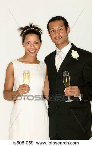 Stock Photo - Newlyweds drinking champagne. Fotosearch