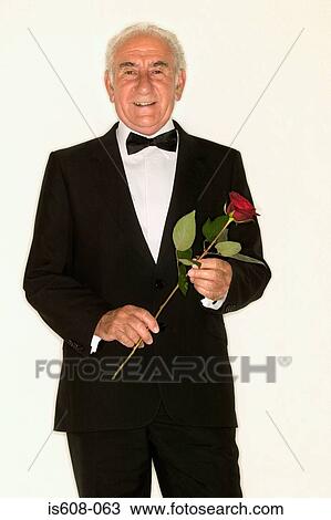 Senior man holding a rose View Large Photo Image Stock Image - Senior man holding a rose. Fotosearch