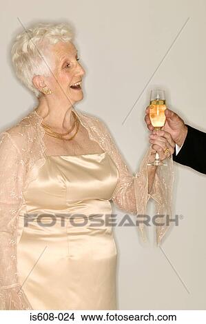 Senior woman with glass of champagne View Large Photo Image Picture - Senior woman with glass of champagne. Fotosearch