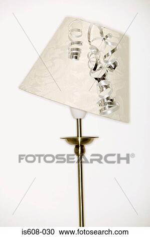 Stock Image - Silver ribbon on lampshade. Fotosearch