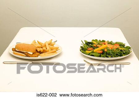 A healthy and unhealthy meal View Large Photo Image Stock Image - A healthy and unhealthy meal. Fotosearch
