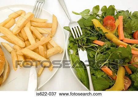 A healthy and unhealthy meal View Large Photo Image Stock Photo - A healthy and unhealthy meal. Fotosearch