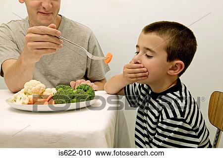Boy rejecting vegetables View Large Photo Image Stock Image - Boy rejecting vegetables. Fotosearch