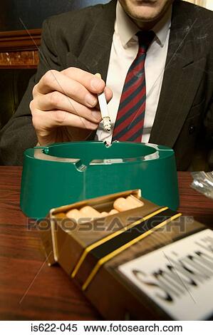 Businessman smoking in bar View Large Photo Image Stock Photography - Businessman smoking in bar. Fotosearch