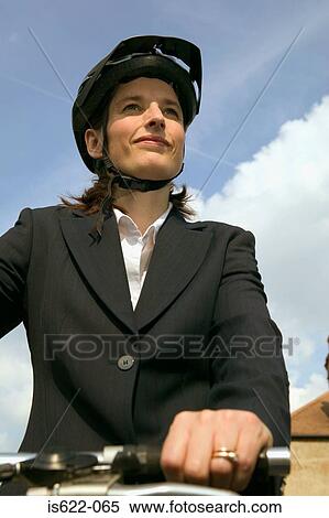 Businesswoman riding a bicycle View Large Photo Image Stock Photography - Businesswoman riding a bicycle. Fotosearch