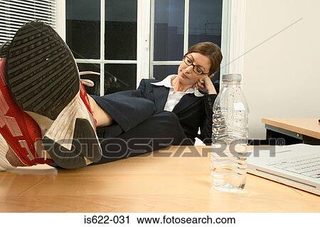 Businesswoman sleeping in office View Large Photo Image Stock Image - Businesswoman sleeping in office. Fotosearch