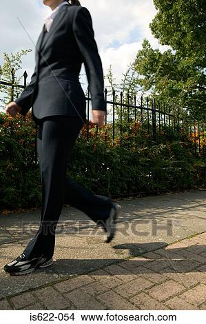 Businesswoman walking View Large Photo Image Picture - Businesswoman walking. Fotosearch