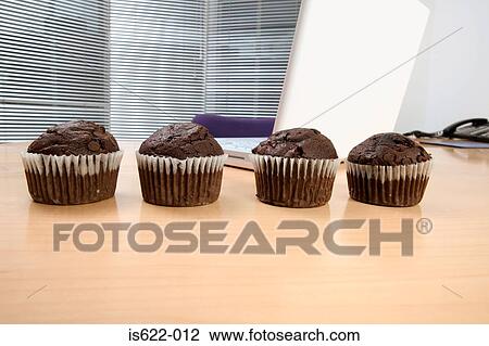 Chocolate muffins on desk View Large Photo Image Stock Image - Chocolate muffins on desk. Fotosearch