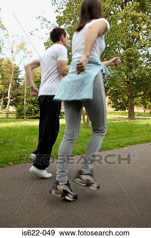 Couple jogging in park View Large Photo Image Stock Photo - Couple jogging in park. Fotosearch