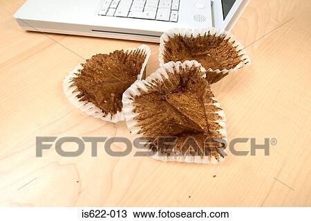 Eaten cakes on desk View Large Photo Image Stock Image - Eaten cakes on desk. Fotosearch