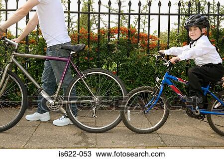Father and son cycling View Large Photo Image Stock Image - Father and son cycling. Fotosearch