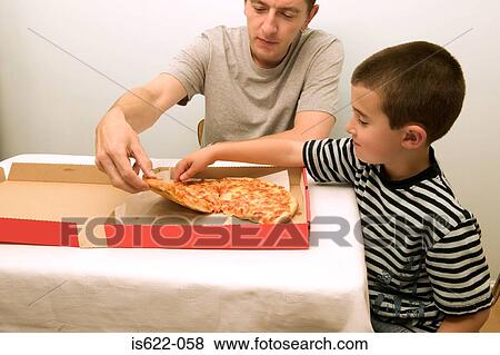 Stock Photo - Father and son eating pizza. Fotosearch