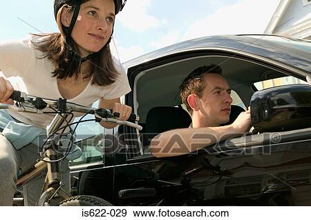 People travelling by automobile and bicycle View Large Photo Image Stock Photo - People travelling by automobile and bicycle. Fotosearch