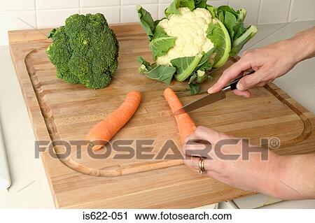 Woman cutting vegetables View Large Photo Image Stock Image - Woman cutting vegetables. Fotosearch