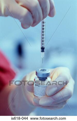 Anesthetist preparing for injection View Large Photo Image Picture - Anesthetist preparing for injection. Fotosearch