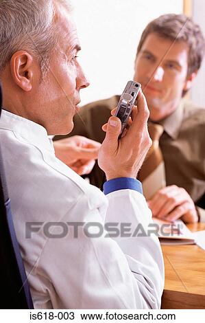 Doctor using a dictaphone View Large Photo Image Stock Image - Doctor using a dictaphone. Fotosearch