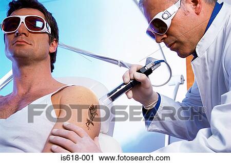 Man having tattoo removed View Large Photo Image Stock Image - Man having tattoo removed. Fotosearch