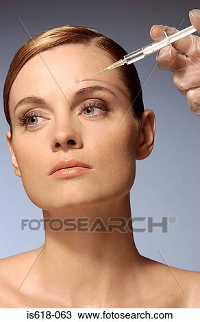 Woman having a BOTOX ® injection View Large Photo Image Stock Image - Woman having a BOTOX ® injection. Fotosearch