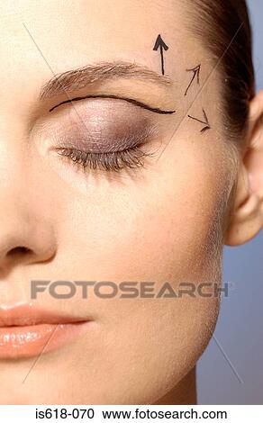 Stock Image - Woman preparing for cosmetic surgery. Fotosearch