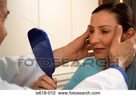 Stock Image - Woman preparing for face lift. Fotosearch