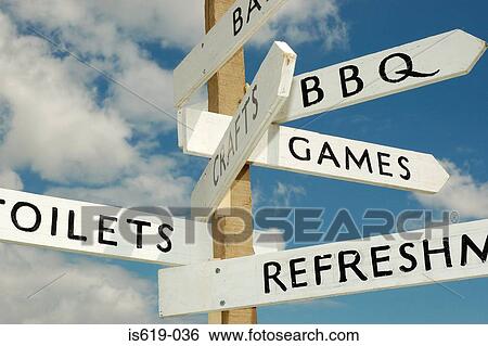 Stock Photograph - Advertising sign on wooden post. Fotosearch