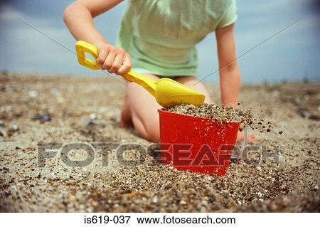 Child playing on beach View Large Photo Image Stock Photo - Child playing on beach. Fotosearch