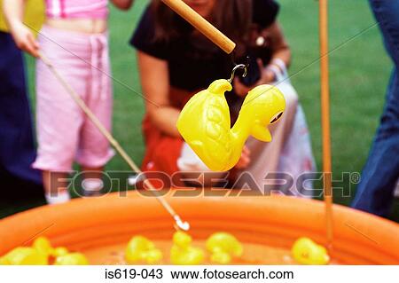 Girl playing game at fete View Large Photo Image Stock Image - Girl playing game at fete. Fotosearch