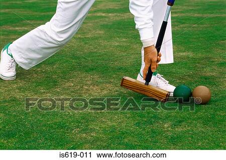 Man playing croquet View Large Photo Image Stock Image - Man playing croquet. Fotosearch
