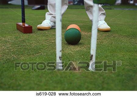 Man playing croquet View Large Photo Image Stock Photo - Man playing croquet. Fotosearch