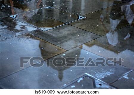 Stock Photo - St pauls cathedral reflected in puddle. Fotosearch