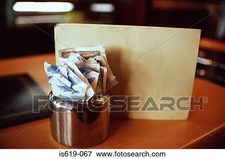 Sugar sachets in restaurant View Large Photo Image Stock Photo - Sugar sachets in restaurant. Fotosearch