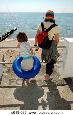 Two girls at the beach View Large Photo Image Stock Photograph - Two girls at the beach. Fotosearch