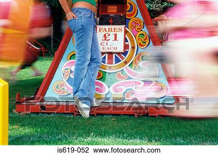 Woman at amusement park View Large Photo Image Stock Image - Woman at amusement park. Fotosearch
