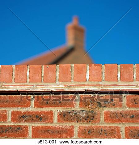 Brick wall near house View Large Photo Image Stock Image - Brick wall near house. Fotosearch