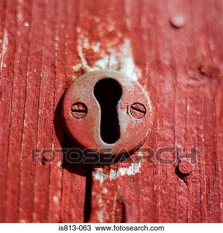 Stock Image - Keyhole on wooden door. Fotosearch