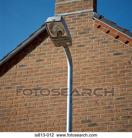 Stock Image - Lamppost near house. Fotosearch