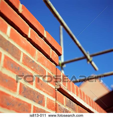Scaffolding on brick wall View Large Photo Image Stock Image - Scaffolding on brick wall. Fotosearch