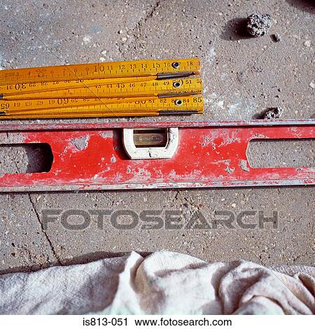Stock Image - Tape measure and spirit level. Fotosearch