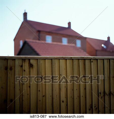 Wooden fence near house View Large Photo Image Stock Photo - Wooden fence near house. Fotosearch
