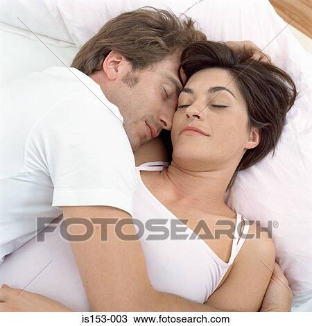 Close couple asleep in bed View Large Photo Image Stock Image - Close couple asleep in bed. Fotosearch