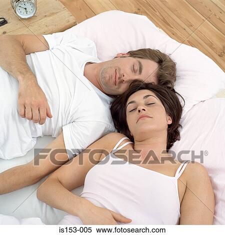 Close couple asleep in bed View Large Photo Image Stock Photography - Close couple asleep in bed. Fotosearch