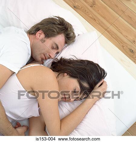 Close couple in bed asleep View Large Photo Image Picture - Close couple in bed asleep. Fotosearch