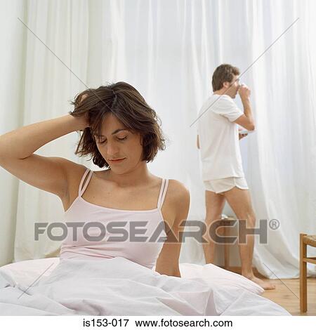 Couple waking up in bedroom View Large Photo Image Stock Photo - Couple waking up in bedroom. Fotosearch