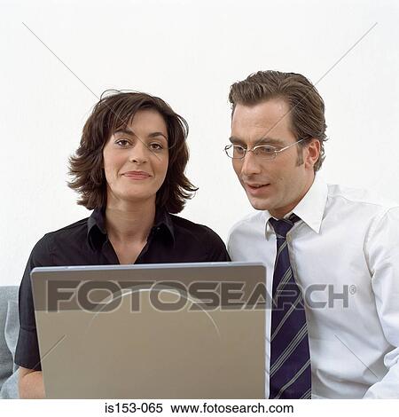 Happy couple with laptop View Large Photo Image Stock Photography - Happy couple with laptop. Fotosearch