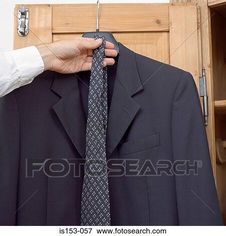 Stock Photo - Man choosing tie. Fotosearch