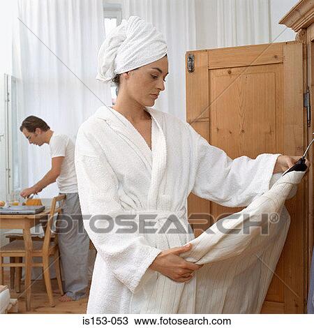 Woman deciding what to wear View Large Photo Image Stock Image - Woman deciding what to wear. Fotosearch