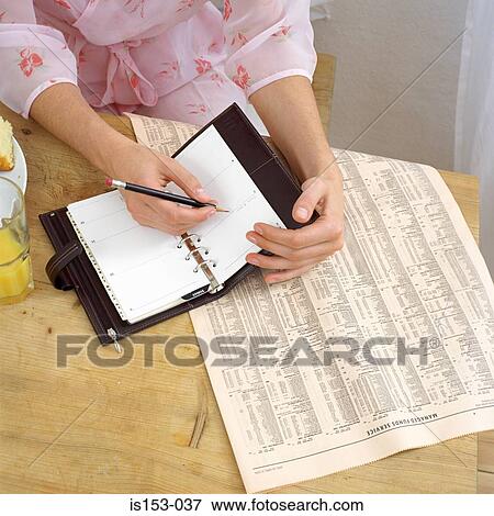 Woman with diary at breakfast View Large Photo Image Stock Photo - Woman with diary at breakfast. Fotosearch