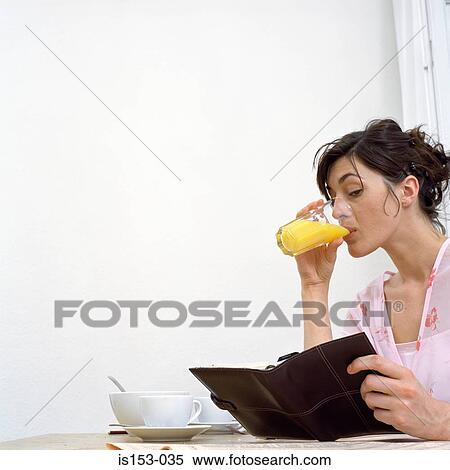 Woman with diary at breakfast View Large Photo Image Stock Photography - Woman with diary at breakfast. Fotosearch