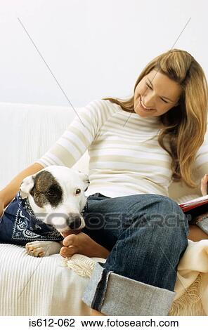 Dog and lady owner on sofa View Large Photo Image Stock Image - Dog and lady owner on sofa. Fotosearch