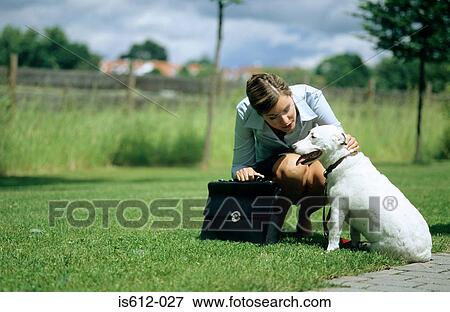 Stock Photo - Dog and owner on way to work. Fotosearch